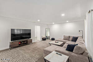 9001 North 13th Avenue Phoenix, AZ 85021 - Photo 6 of 25 a living room with furniture and a flat screen tv
