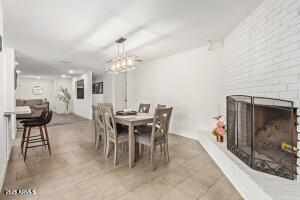 9001 North 13th Avenue Phoenix, AZ 85021 - Photo 8 of 25 a view of a dining room with furniture and wooden floor