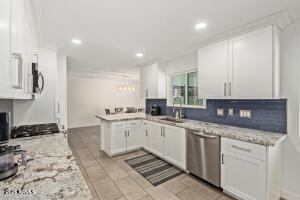 9001 North 13th Avenue Phoenix, AZ 85021 - Photo 9 of 25 a kitchen with a sink and cabinets