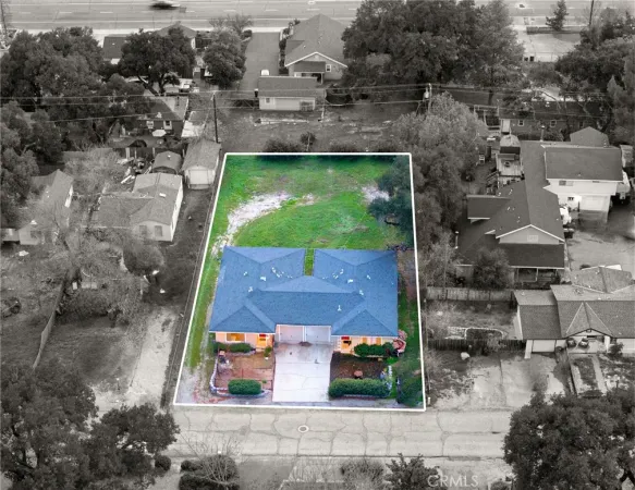 a aerial view of a house with a yard