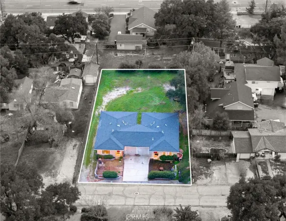 a aerial view of a house with a yard