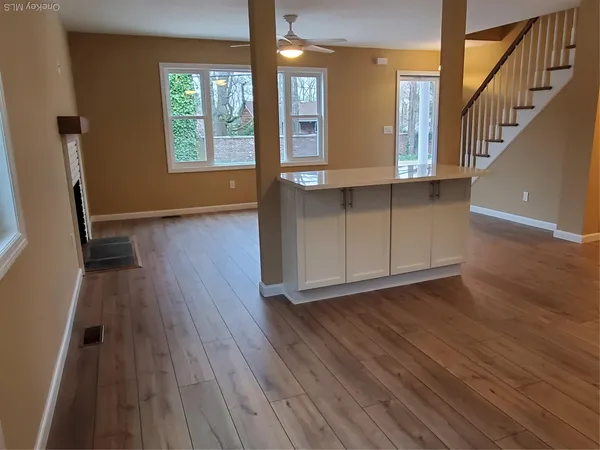a view of an entryway with wooden floors