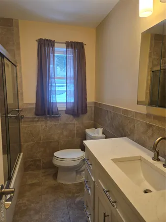 a bathroom with a sink and a toilet