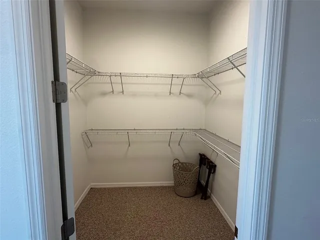 a view of storage and utility room with racks on the wall