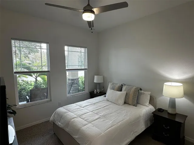a utility room with wooden floor washer and dryer