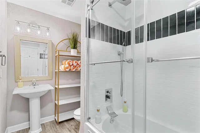 a view of a bathroom with a sink and mirror