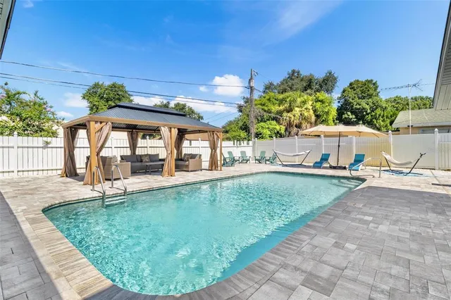 a view of a swimming pool with a patio