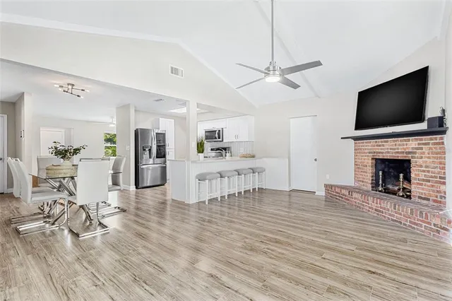 a living room with furniture fireplace and flat screen tv