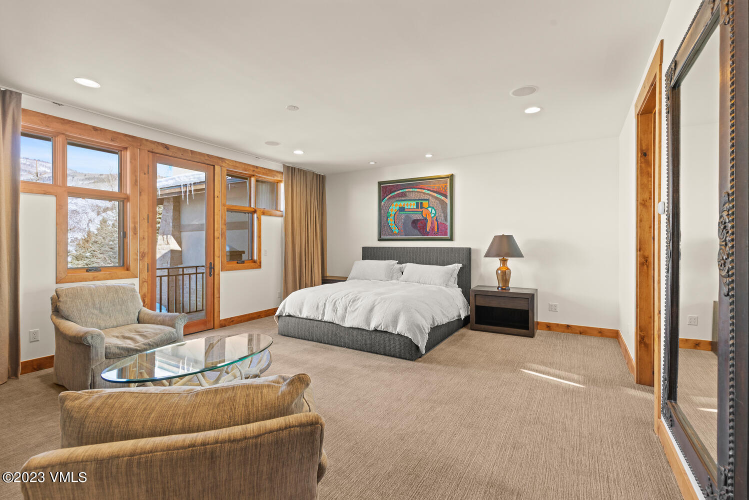 589 Eagle Drive Eagle-Vail, CO 81620 - Photo 11 of 33 a spacious bedroom with a bed and glass window