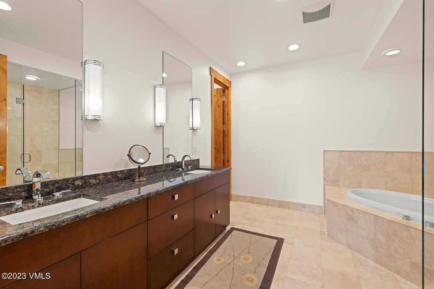 589 Eagle Drive Eagle-Vail, CO 81620 - Photo 15 of 33 a bath room with a sink and a mirror