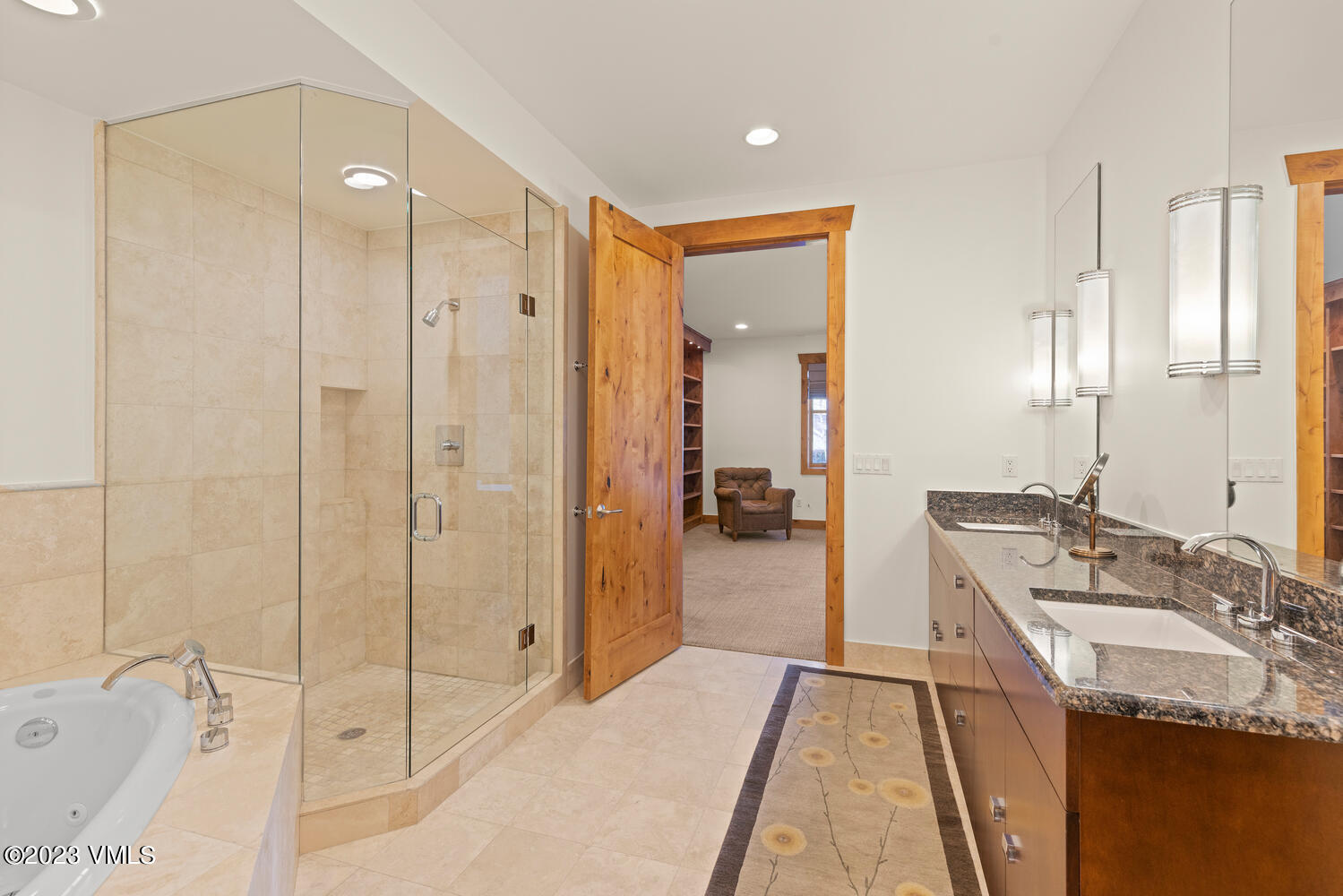 589 Eagle Drive Eagle-Vail, CO 81620 - Photo 16 of 33 a bathroom with a tub sink shower and mirror