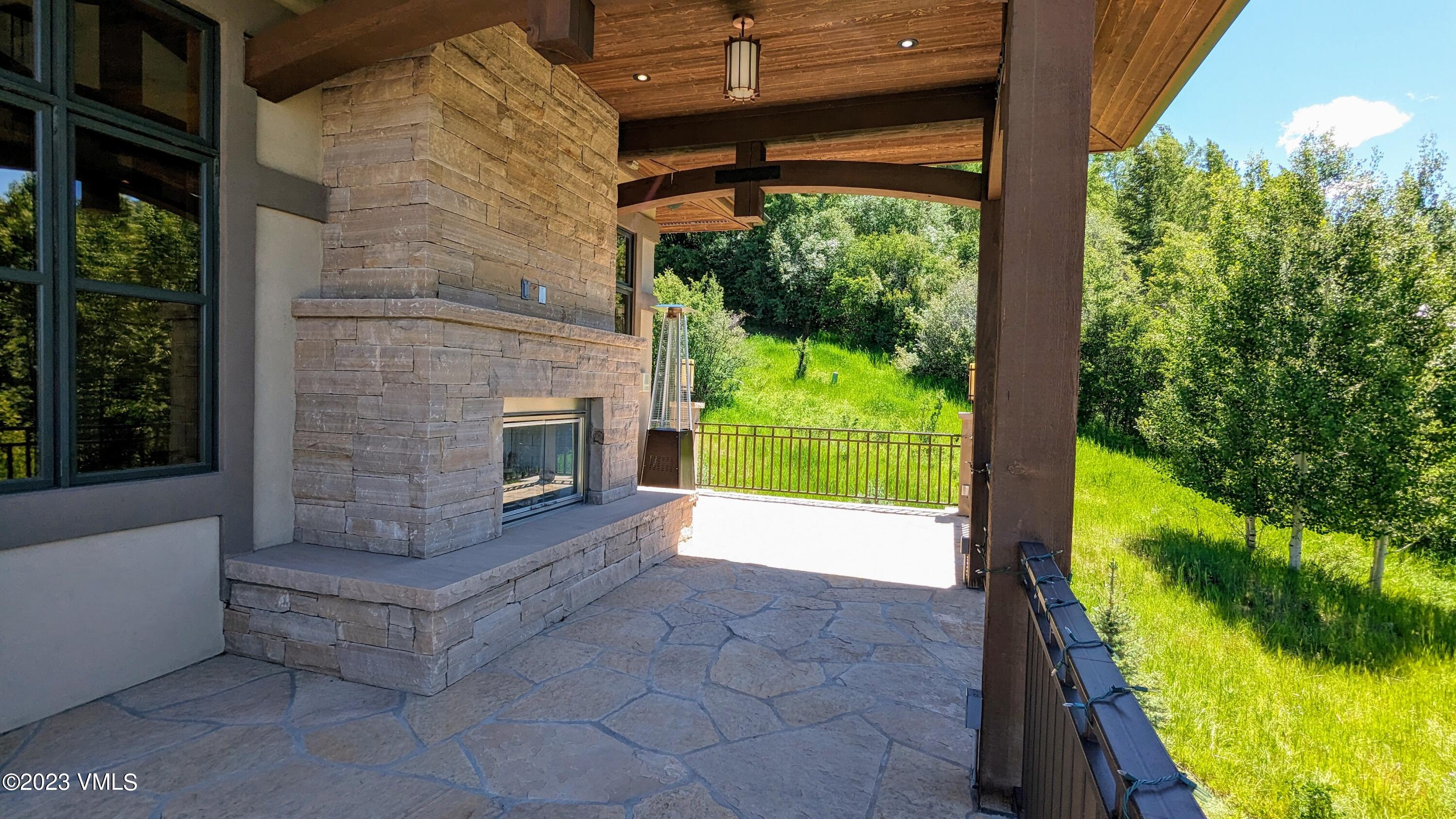 589 Eagle Drive Eagle-Vail, CO 81620 - Photo 28 of 33 a view of an empty room with a fireplace and a floor to ceiling window
