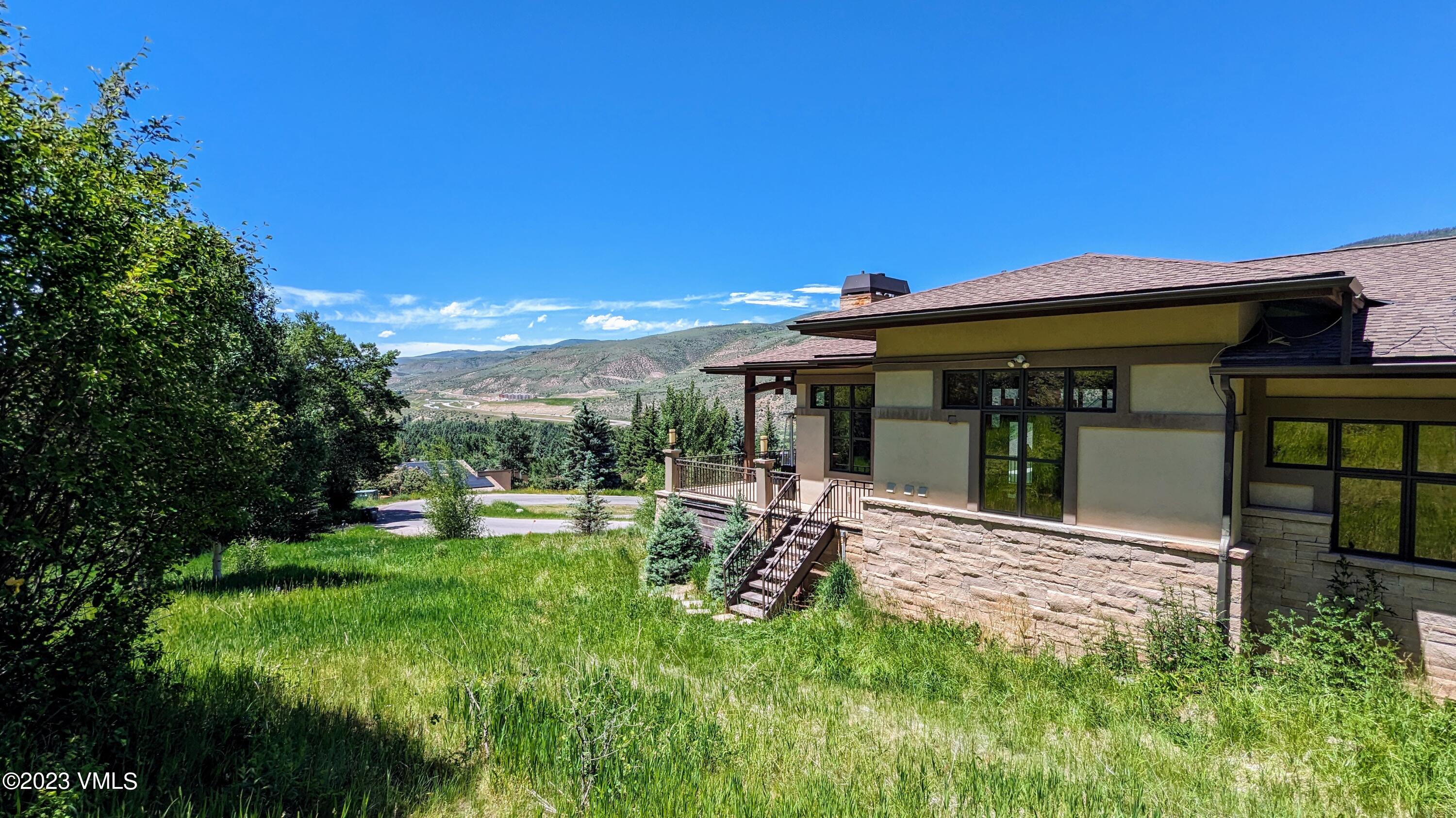 589 Eagle Drive Eagle-Vail, CO 81620 - Photo 32 of 33 a view of a house with backyard porch and sitting area