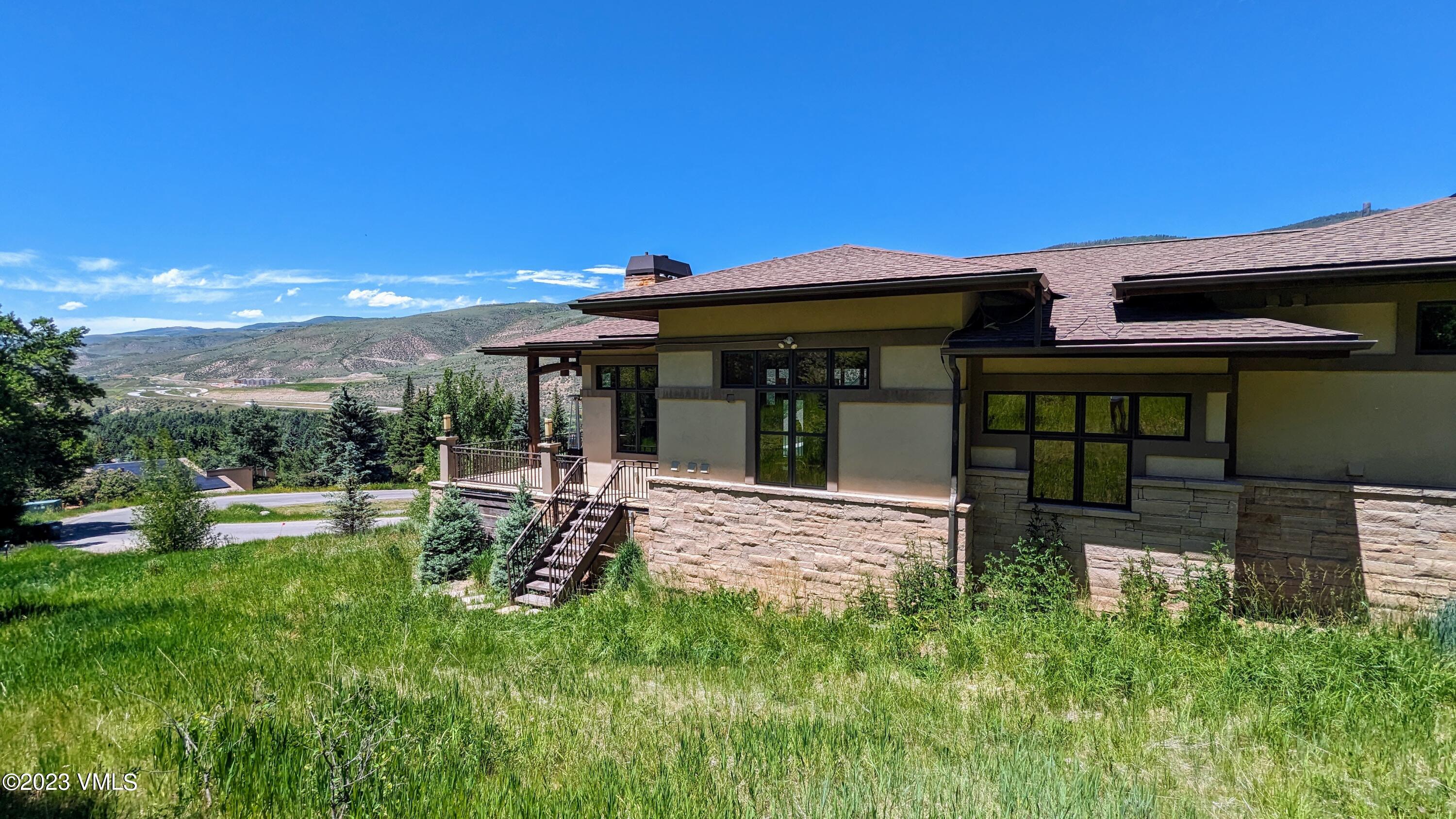 589 Eagle Drive Eagle-Vail, CO 81620 - Photo 33 of 33 a view of a house with backyard porch and sitting area