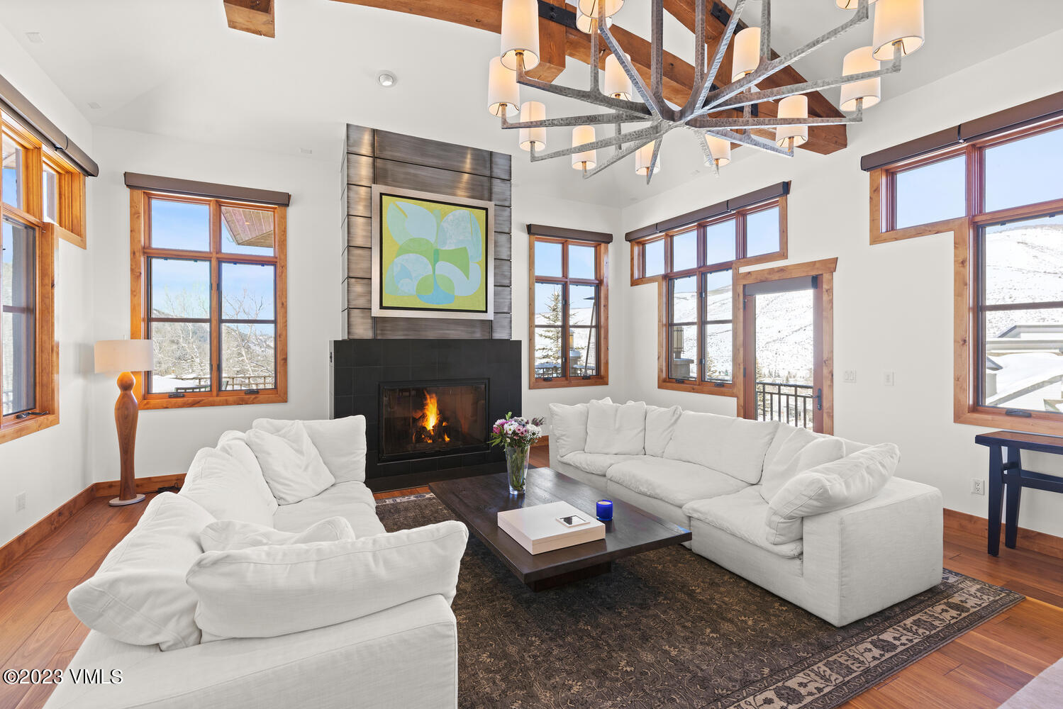 589 Eagle Drive Eagle-Vail, CO 81620 - Photo 4 of 33 a living room with furniture a fireplace and a large window