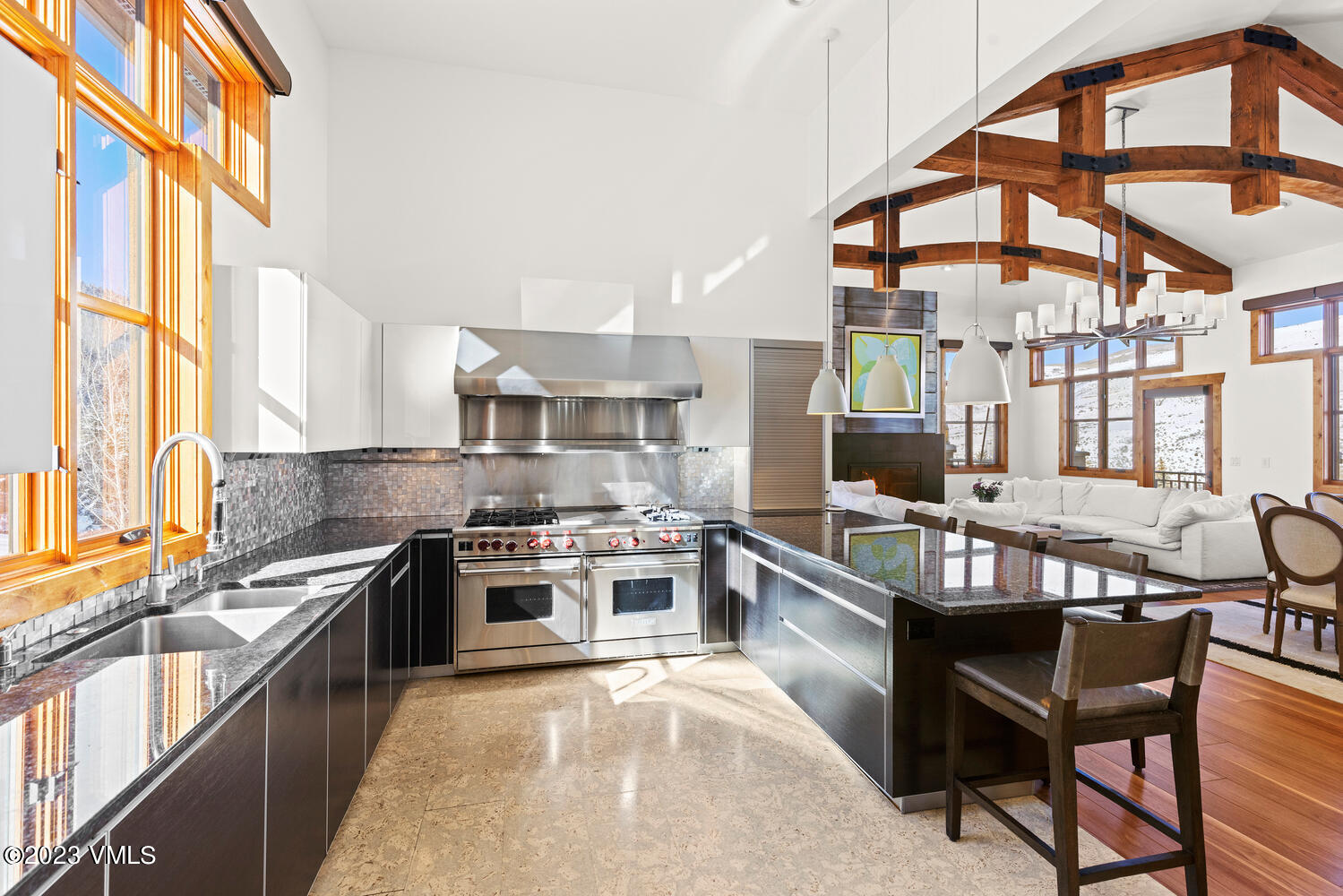 589 Eagle Drive Eagle-Vail, CO 81620 - Photo 8 of 33 a kitchen with stainless steel appliances granite countertop a stove and a wooden cabinets