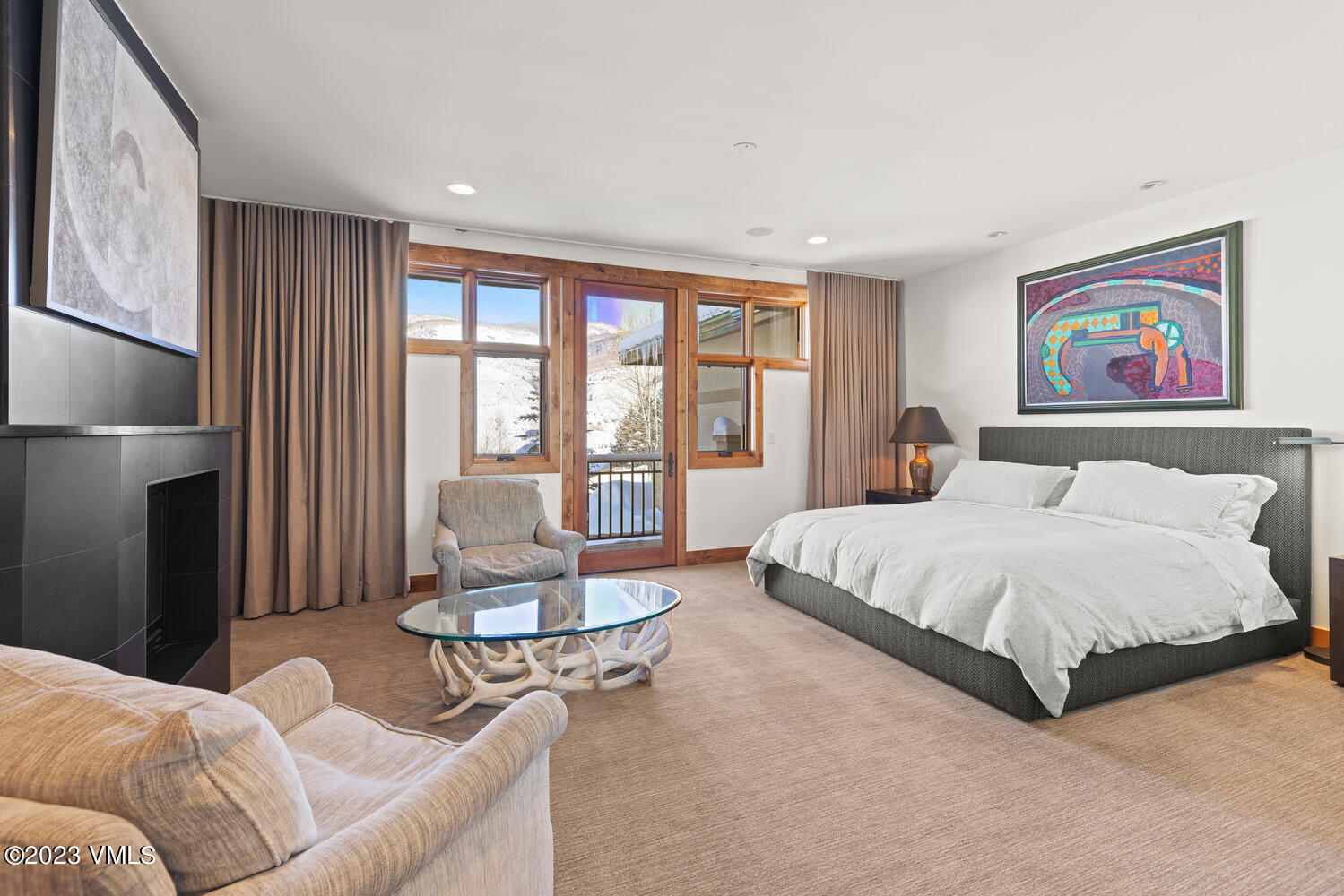 589 Eagle Drive Eagle-Vail, CO 81620 - Photo 10 of 33 a spacious bedroom with a bed a couch and large window