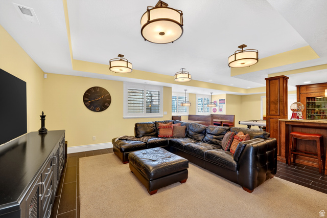 714 Draper Heights Way Draper, UT 84020 - Photo 64 of 88 Living room featuring a raised ceiling, wood tiled floors, and recessed lighting