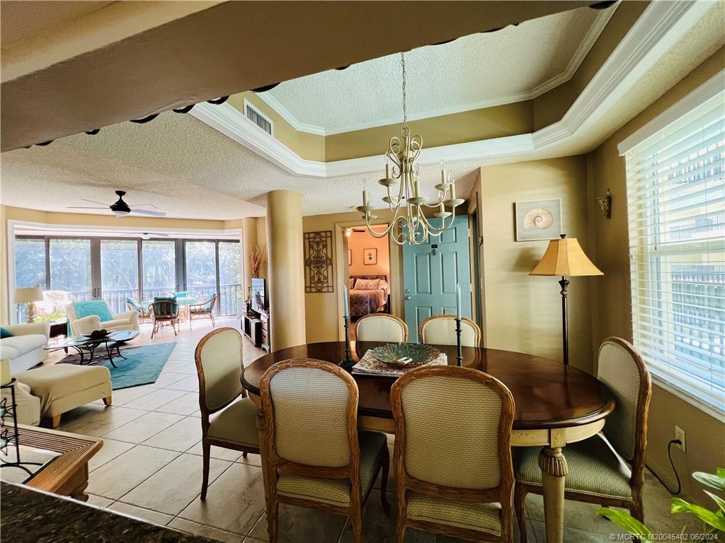221 Northeast Plantation Road, Unit 215 Stuart, FL 34996 - Photo 43 of 83 a view of a dining room with furniture window and outside view