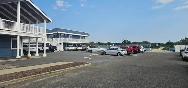 a view of a car parked in front of a house