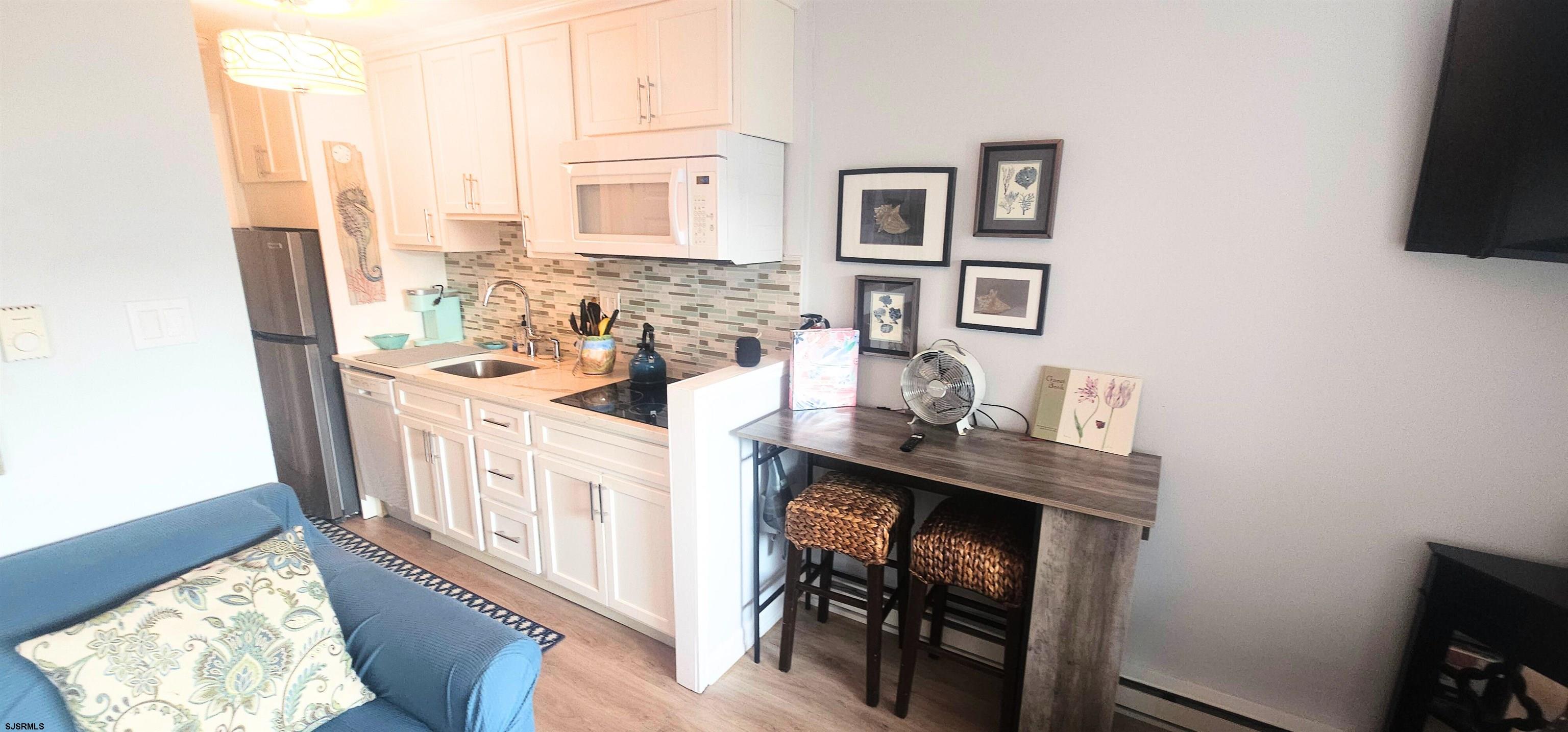 212 West Brigantine Avenue, Unit 206 Brigantine, NJ 08203 - Photo 7 of 8 a view of a kitchen with electric appliances