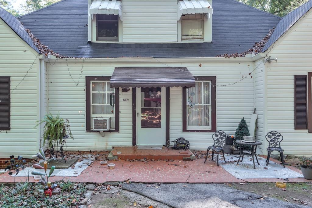 819 Northern Avenue Clarkston, GA 30021 - Photo 9 of 21 a front view of a house with outdoor seating