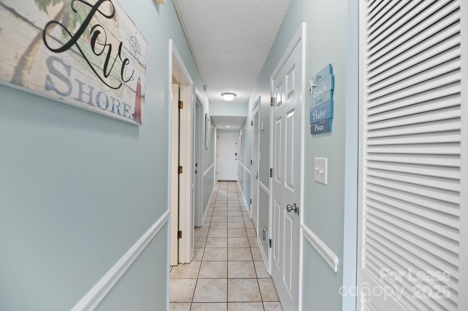 201 Double Eagle Drive, Unit E1 Surfside Beach, SC 29575 - Photo 14 of 19 a view of a hallway with a elevator