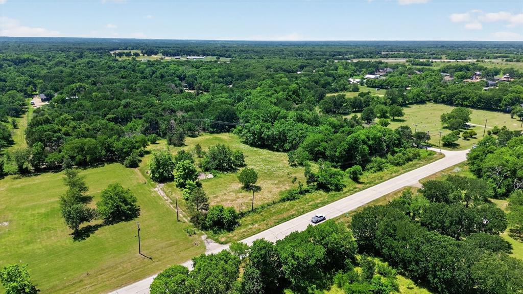 613 Main Street Quinlan, TX 75474 - Photo 3 of 16 Lot featuring mature trees and open grassy areas