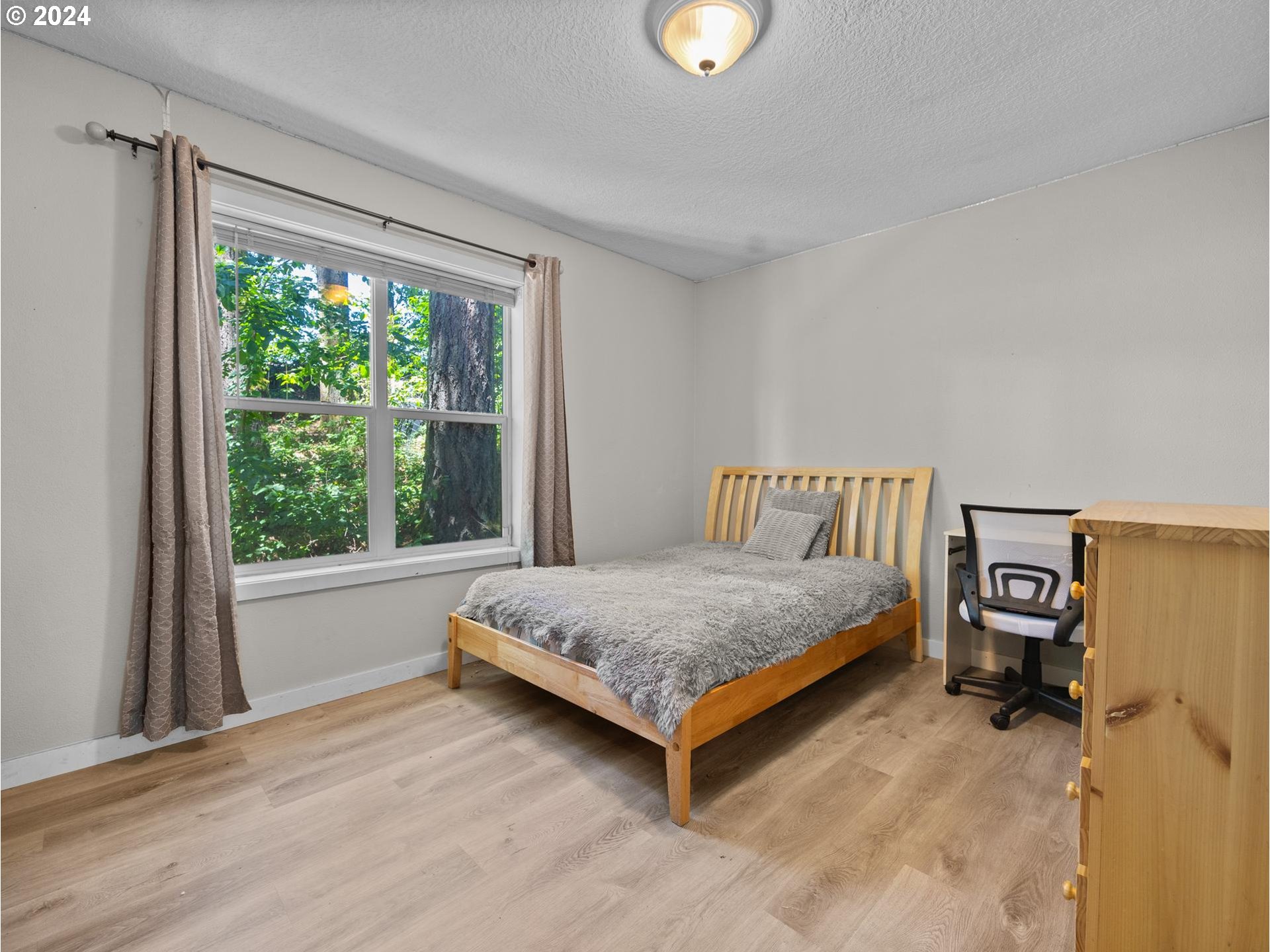 32980 Southwest Firdale Road Cornelius, OR 97113 - Photo 13 of 48 a bedroom with a bed and a window
