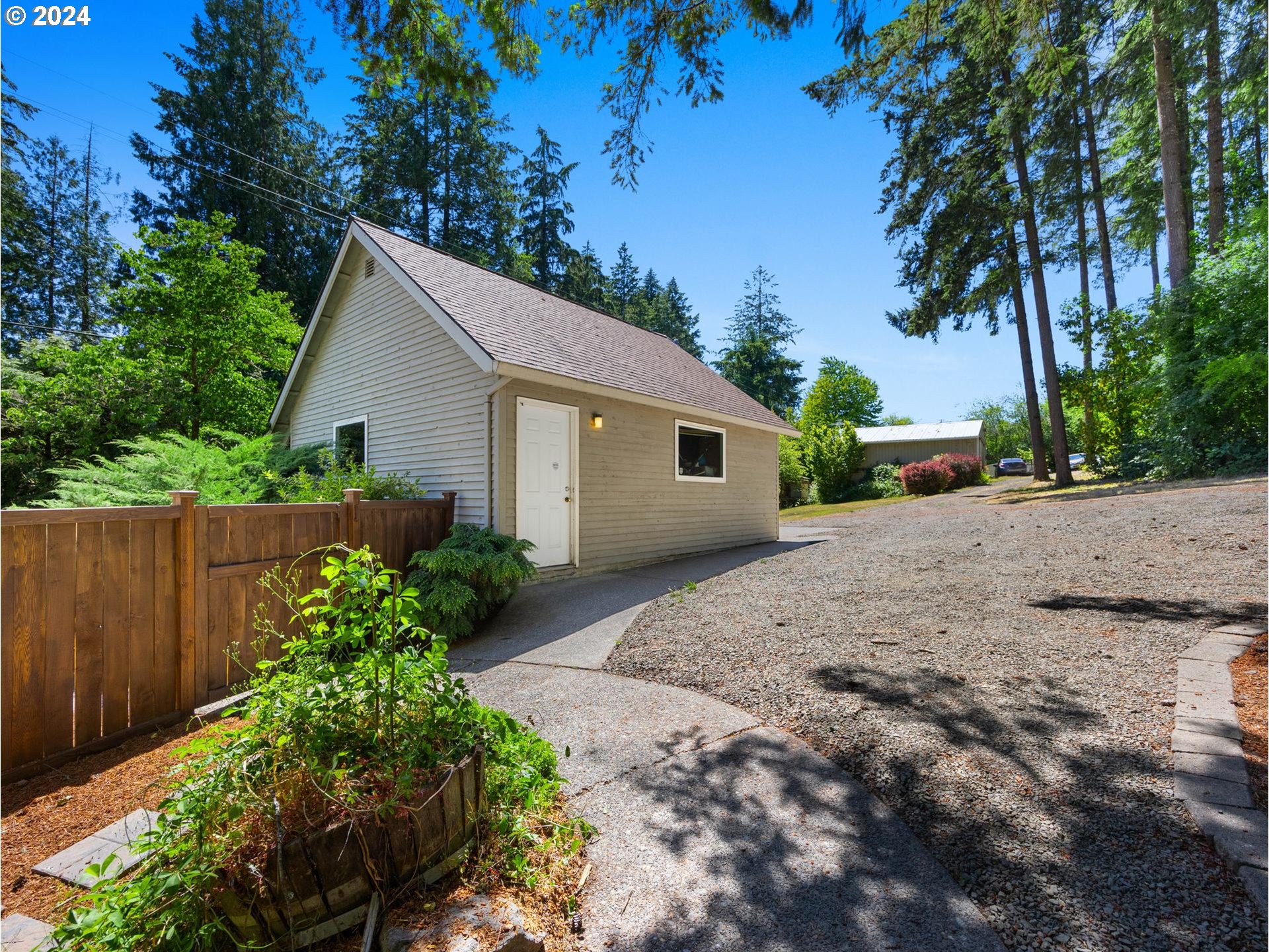 32980 Southwest Firdale Road Cornelius, OR 97113 - Photo 24 of 48 a view of a house with a yard and potted plants