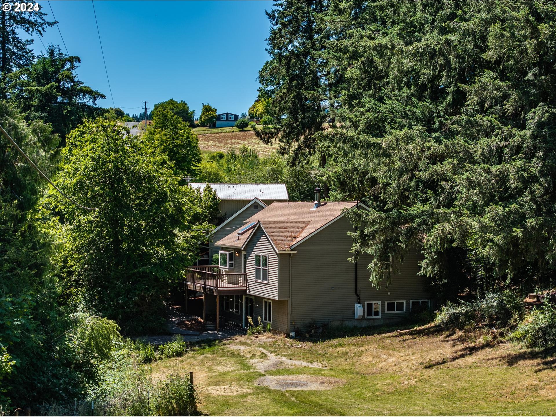 32980 Southwest Firdale Road Cornelius, OR 97113 - Photo 31 of 48 a aerial view of a house with swimming pool next to a yard