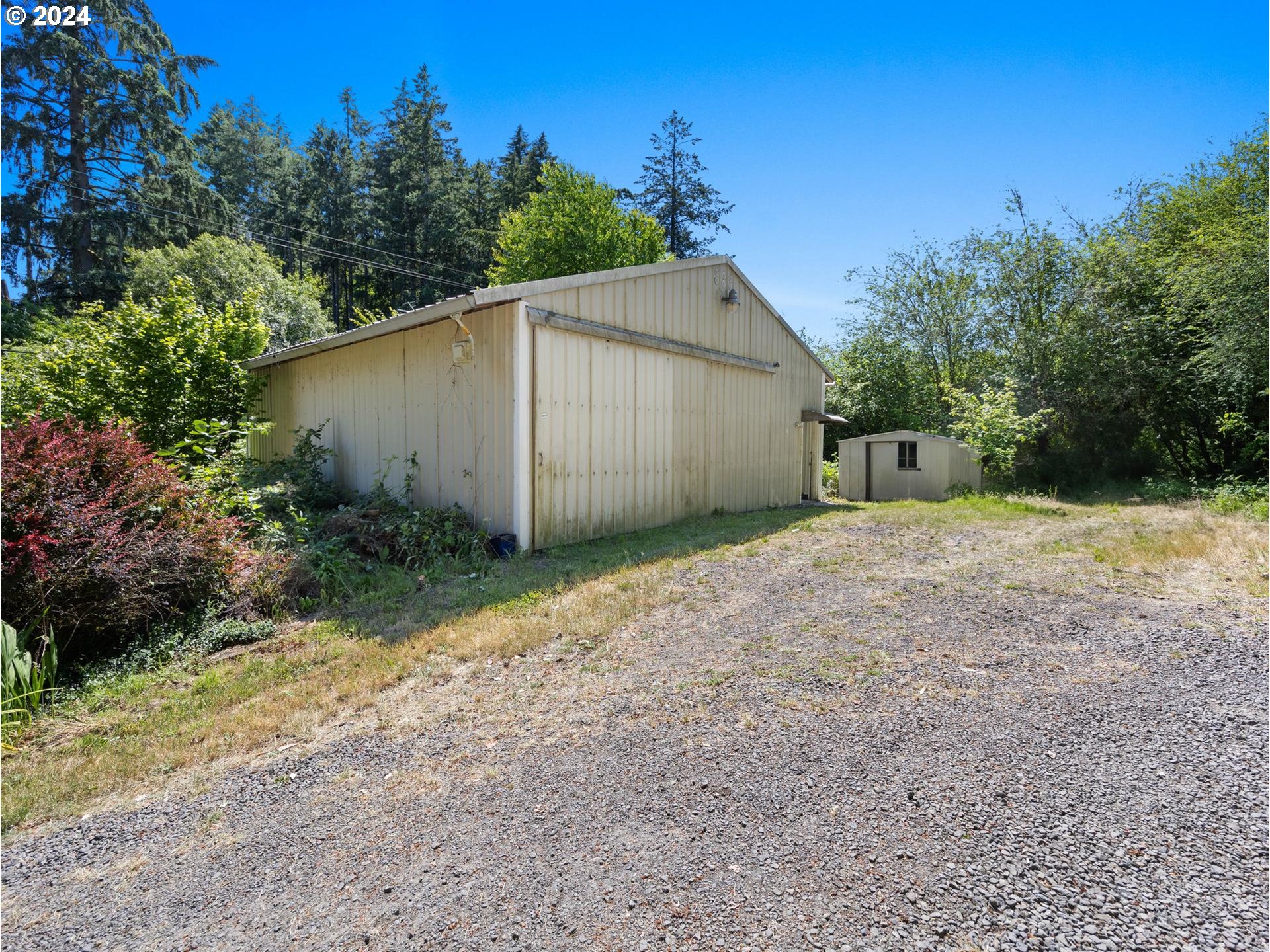 32980 Southwest Firdale Road Cornelius, OR 97113 - Photo 35 of 48 a backyard of a house with plants and trees