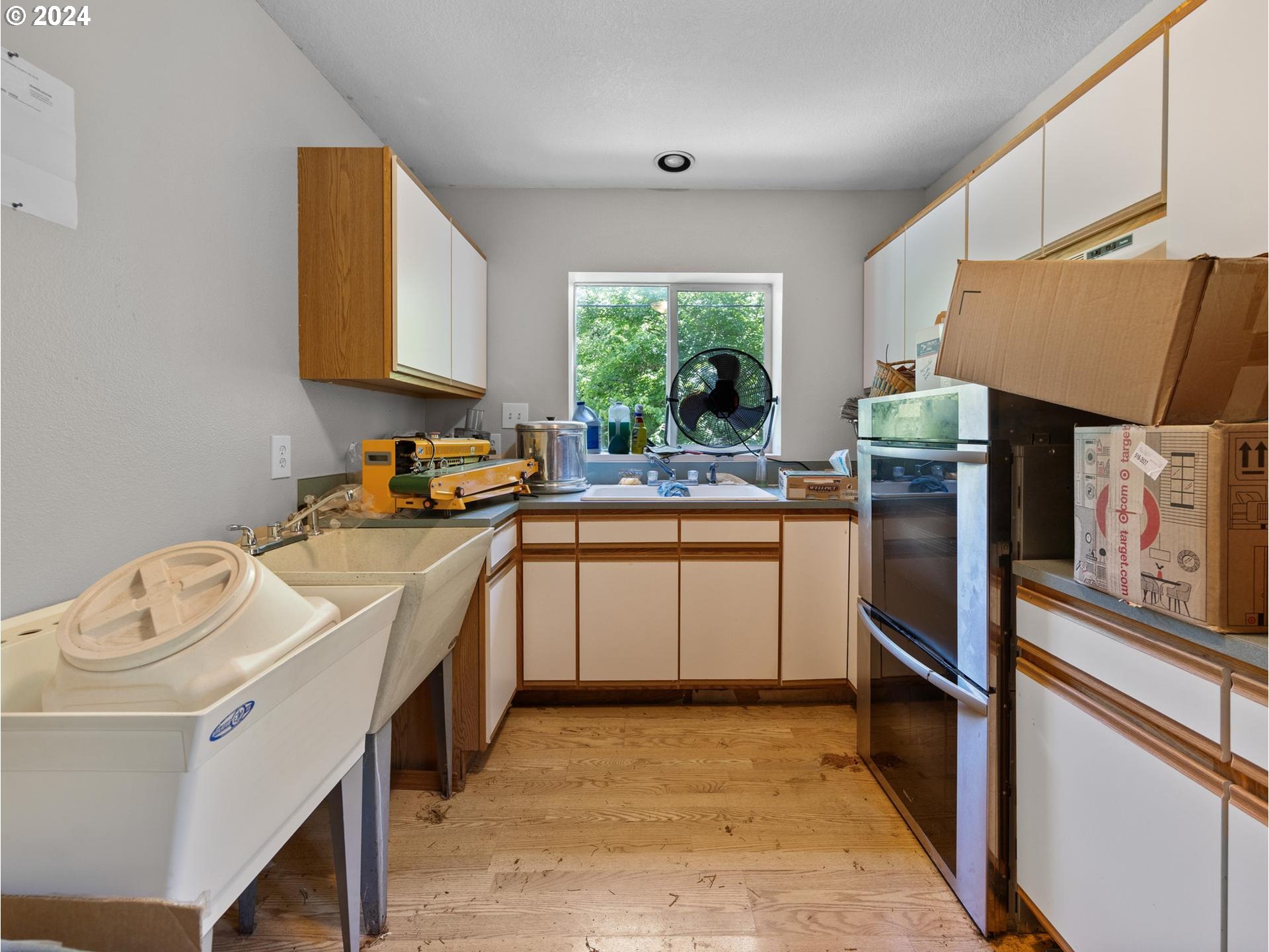 32980 Southwest Firdale Road Cornelius, OR 97113 - Photo 37 of 48 a kitchen with a sink stove and refrigerator