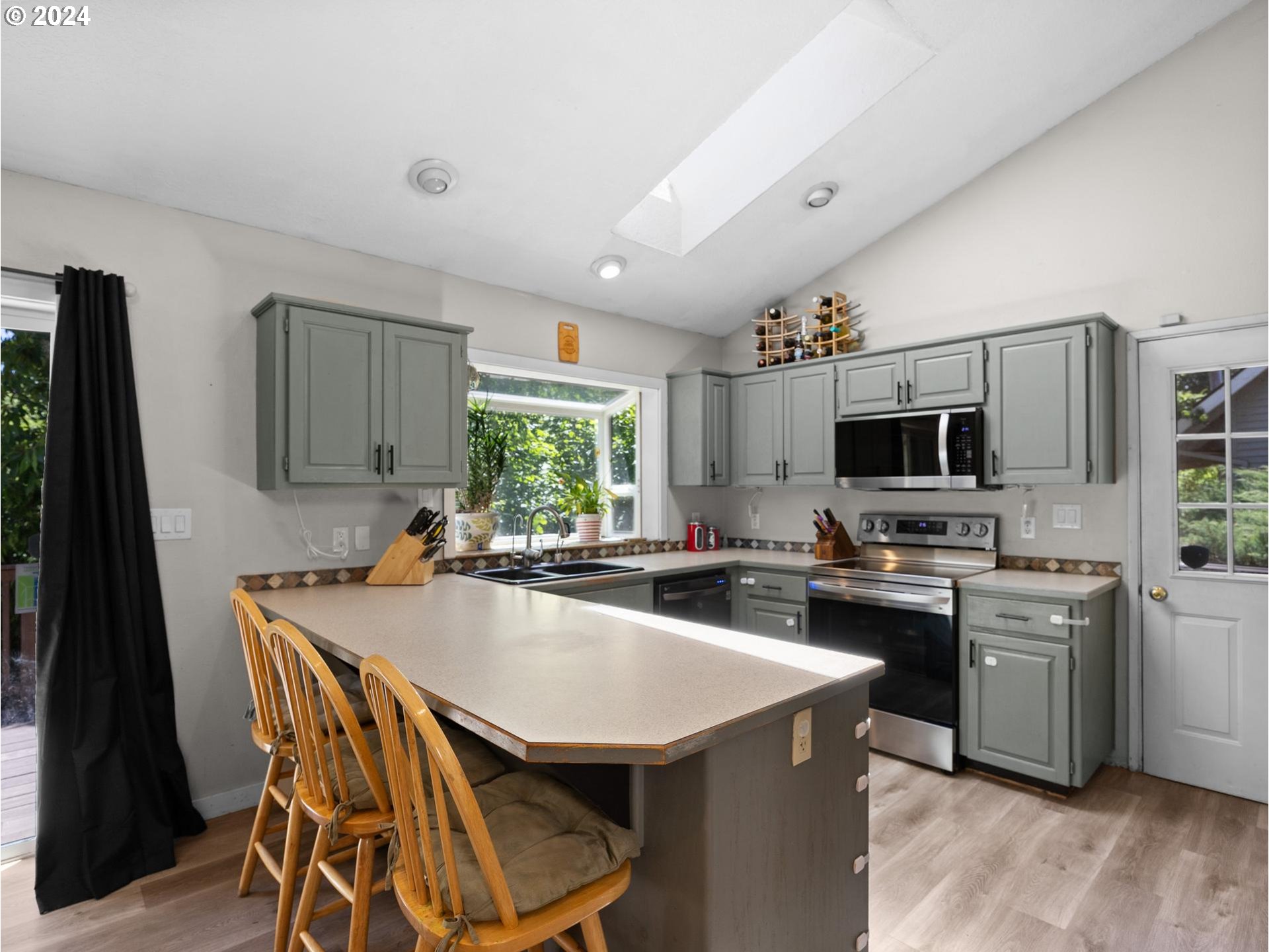32980 Southwest Firdale Road Cornelius, OR 97113 - Photo 6 of 48 a kitchen with kitchen island a sink table and chairs