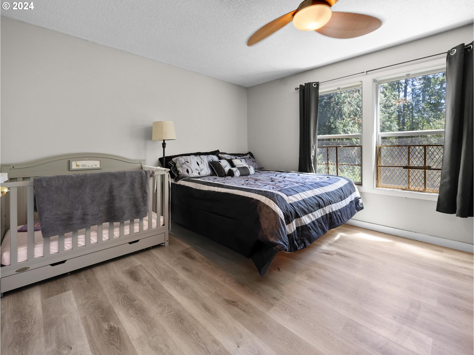 32980 Southwest Firdale Road Cornelius, OR 97113 - Photo 10 of 48 a bedroom with a bed and a large window with outer view