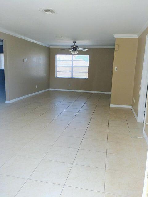 925 Southeast Albatross Avenue Port St. Lucie, FL 34983 - Photo 6 of 7 a view of an empty room with a window