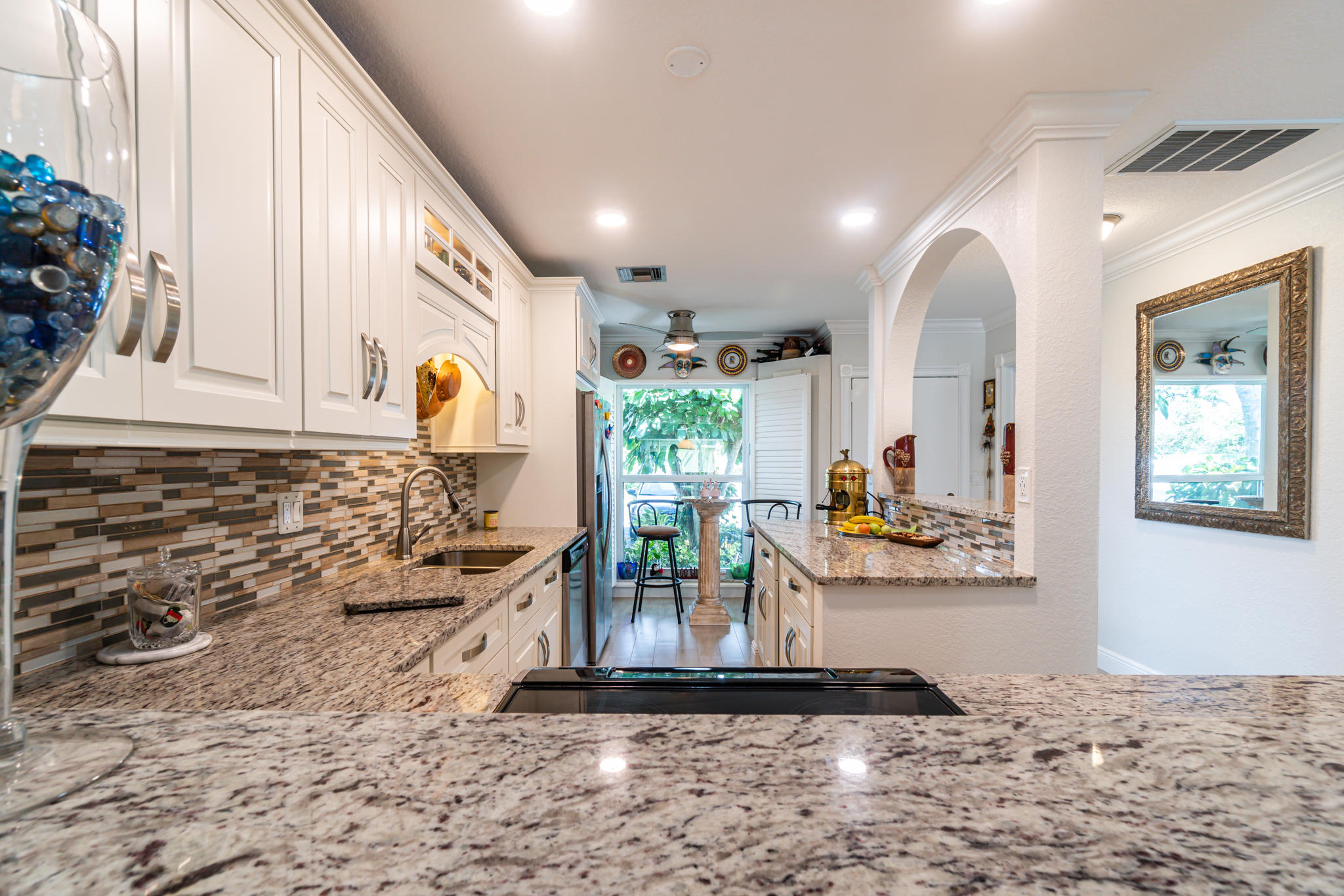 13831 Vía Flora, Unit A Delray Beach, FL 33484 - Photo 1 of 47 a view of a living room and floor to ceiling window or couch