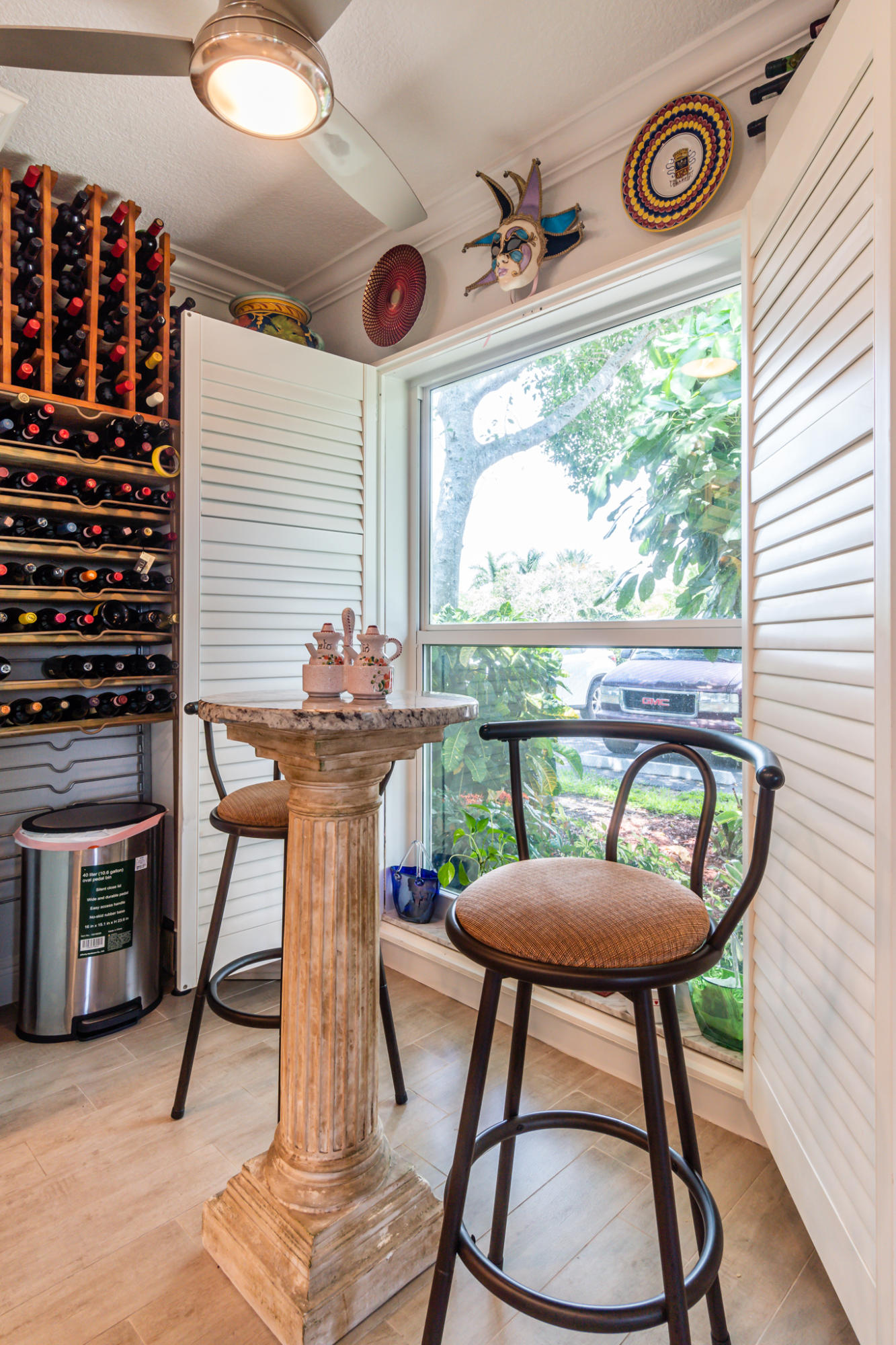 13831 Vía Flora, Unit A Delray Beach, FL 33484 - Photo 11 of 47 a view of a dining room with furniture window and wooden floor