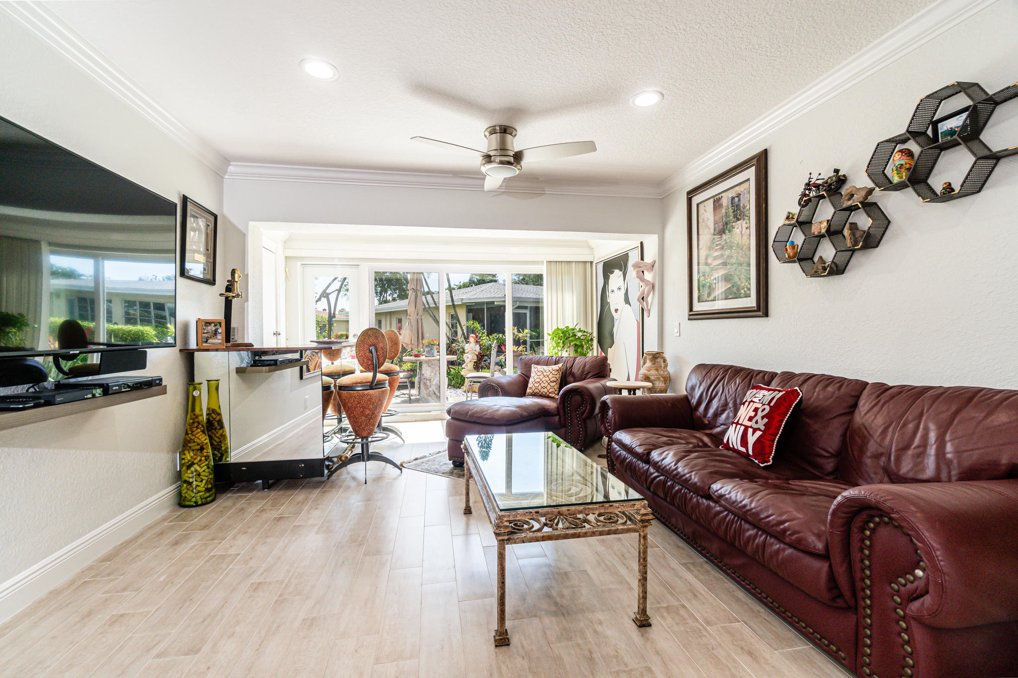 13831 Vía Flora, Unit A Delray Beach, FL 33484 - Photo 14 of 47 a living room with furniture and a large window