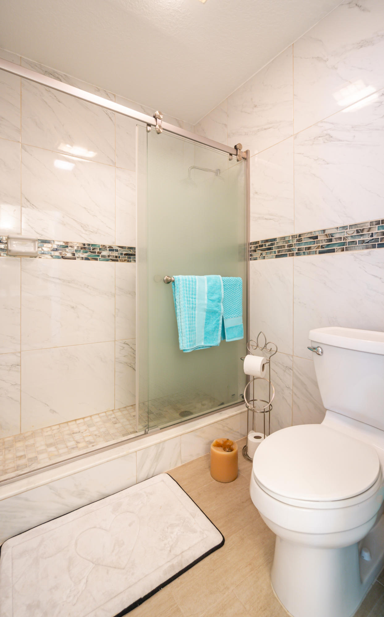 13831 Vía Flora, Unit A Delray Beach, FL 33484 - Photo 20 of 47 a bathroom with a toilet and a shower