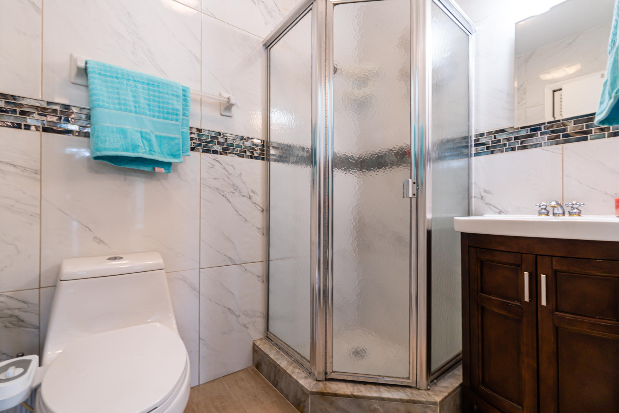 13831 Vía Flora, Unit A Delray Beach, FL 33484 - Photo 22 of 47 a bathroom with a toilet and a sink