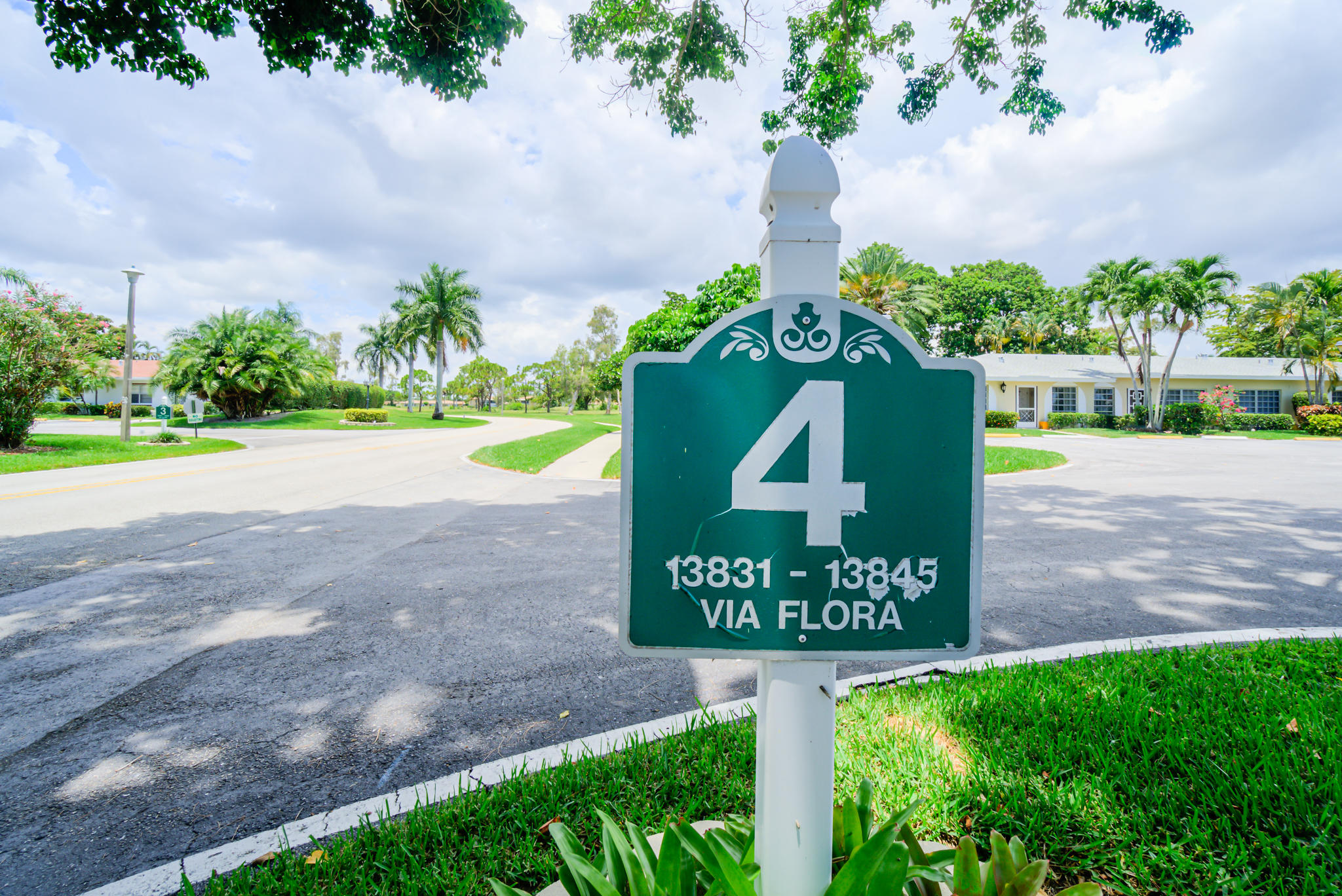 13831 Vía Flora, Unit A Delray Beach, FL 33484 - Photo 27 of 47 a sign that is sitting on the side of a road