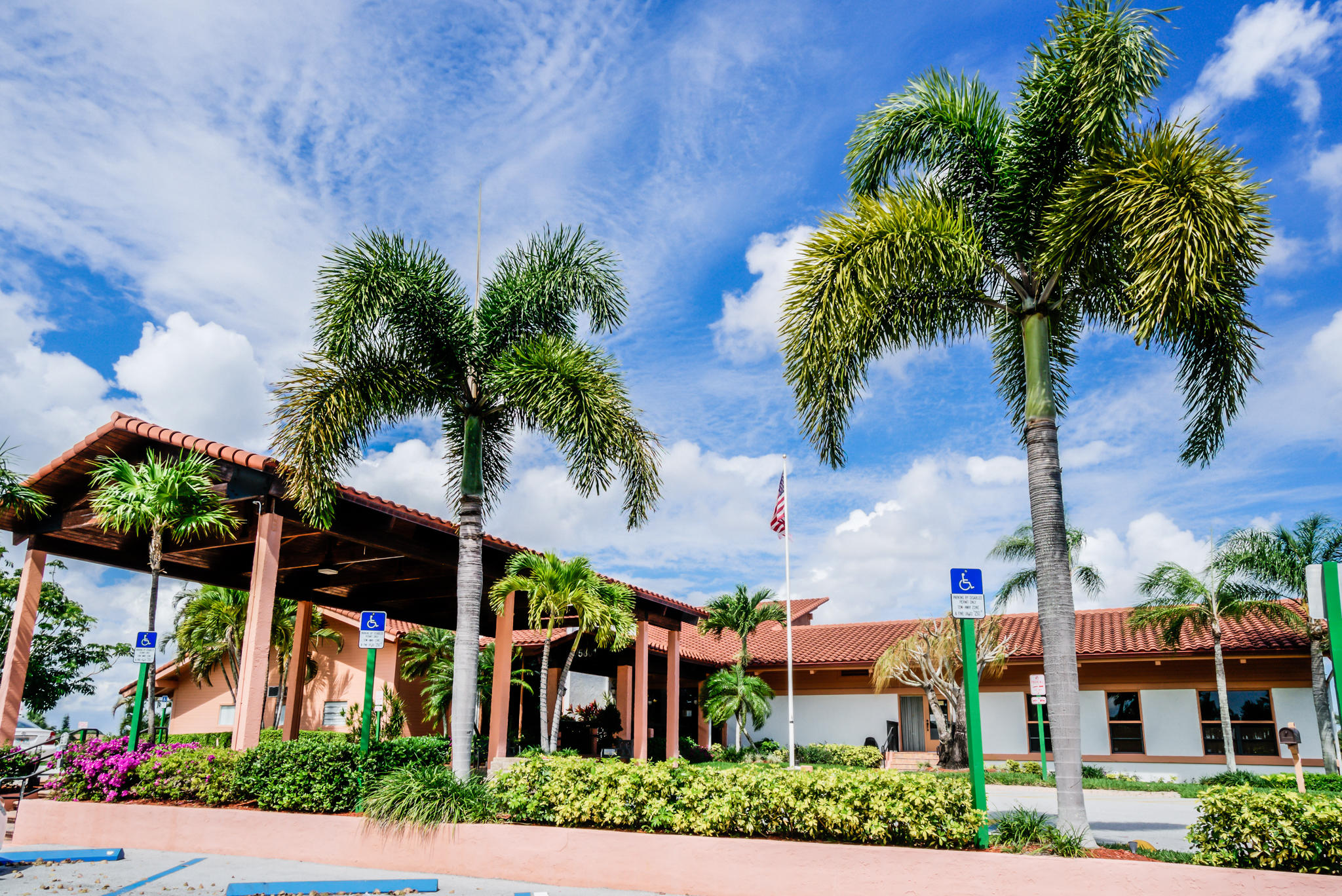 13831 Vía Flora, Unit A Delray Beach, FL 33484 - Photo 30 of 47 a front view of a house with garden