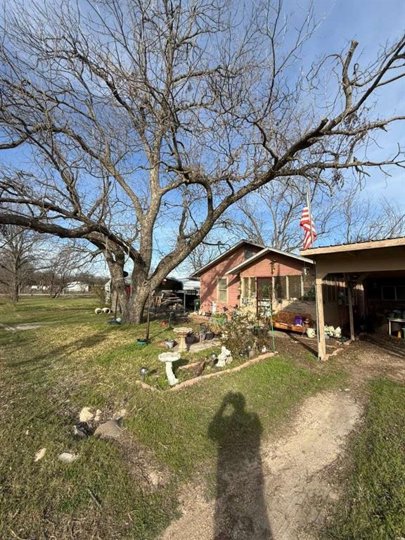 710 Whitney Street Morgan, TX 76671 - Photo 4 of 22 a view of a yard with a house