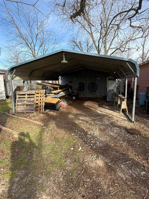 710 Whitney Street Morgan, TX 76671 - Photo 7 of 22 a view of patio area with table and chairs under an umbrella