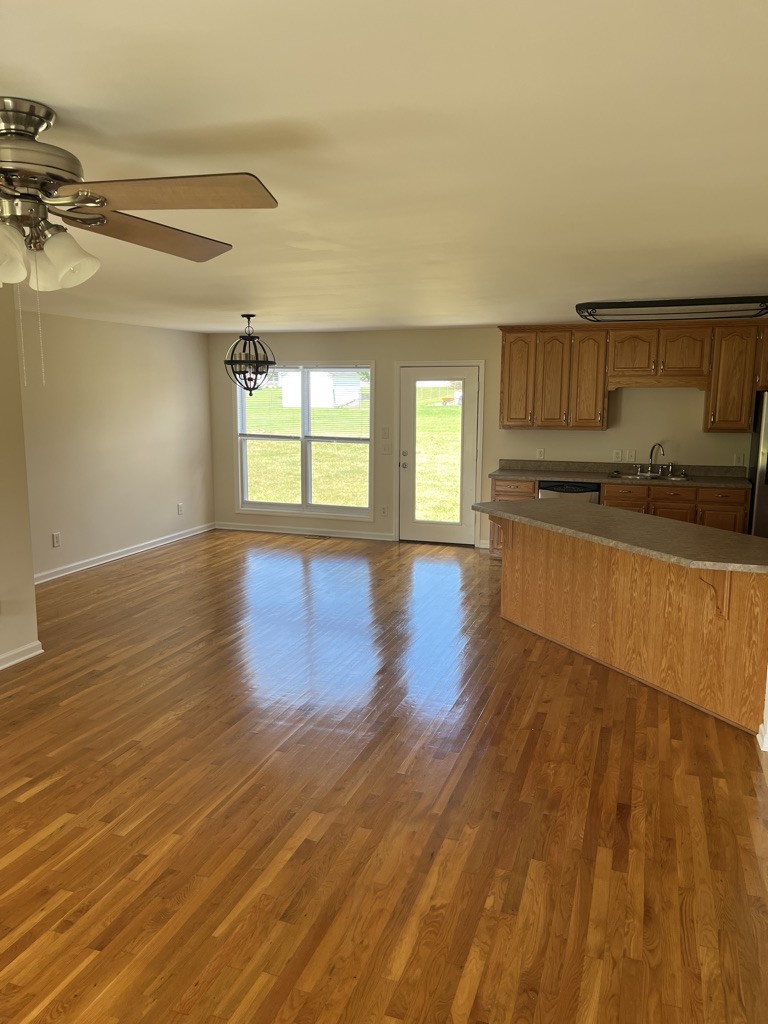 700 Old Liberty Road Alexandria, TN 37012 - Photo 5 of 12 an empty room with wooden floor and windows