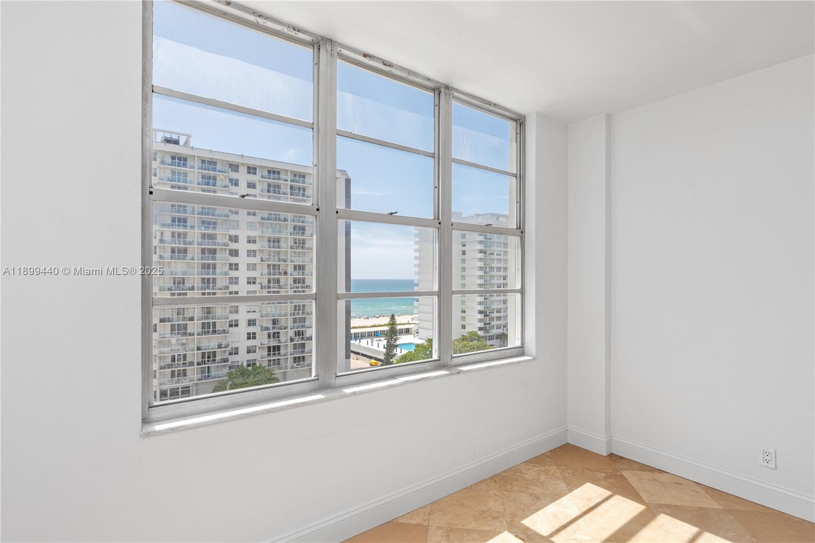 5700 Collins Avenue, Unit 10D Miami Beach, FL 33140 - Photo 19 of 47 a view of an empty room with a window