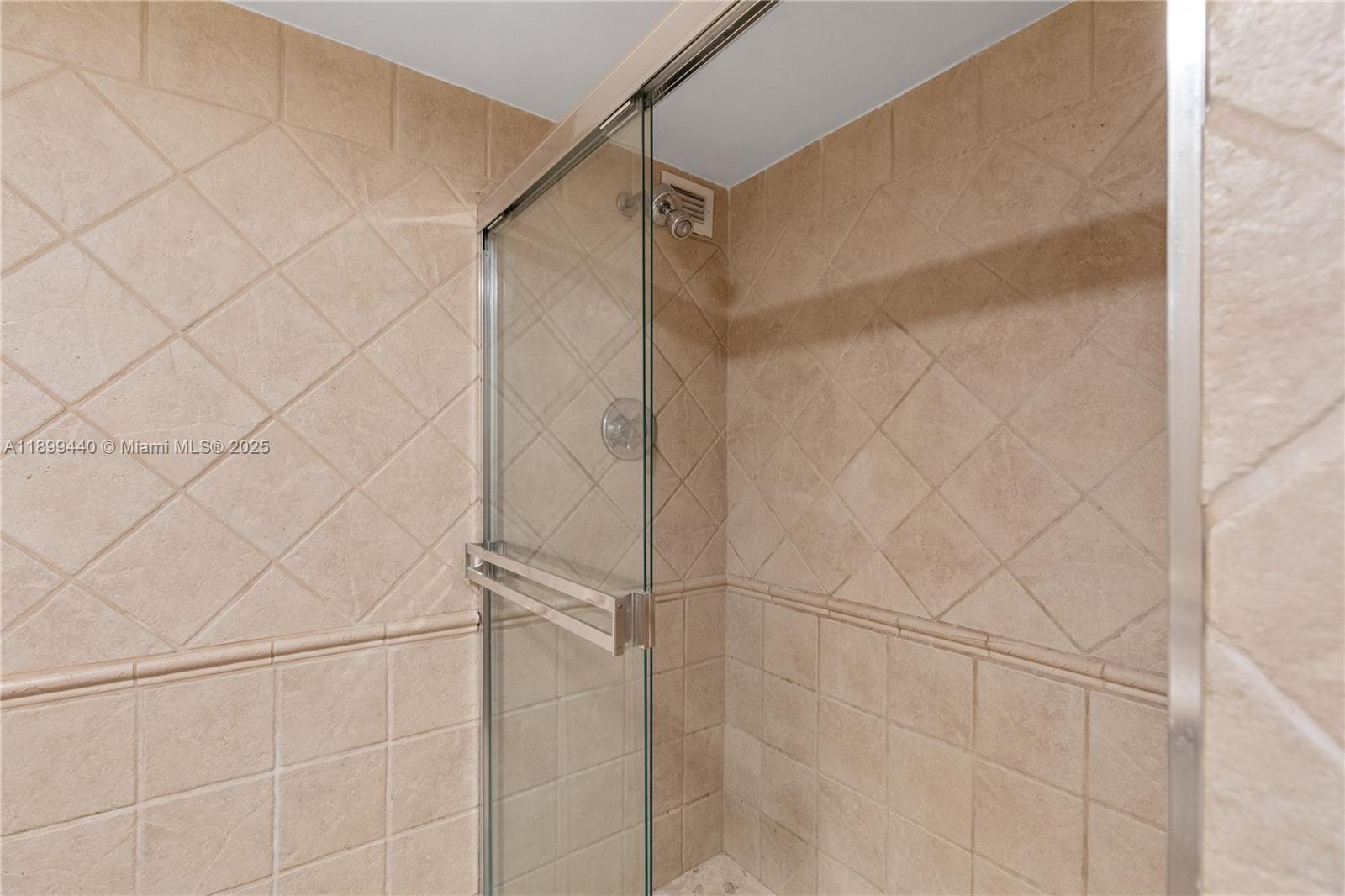 5700 Collins Avenue, Unit 10D Miami Beach, FL 33140 - Photo 28 of 47 a bathroom with a shower