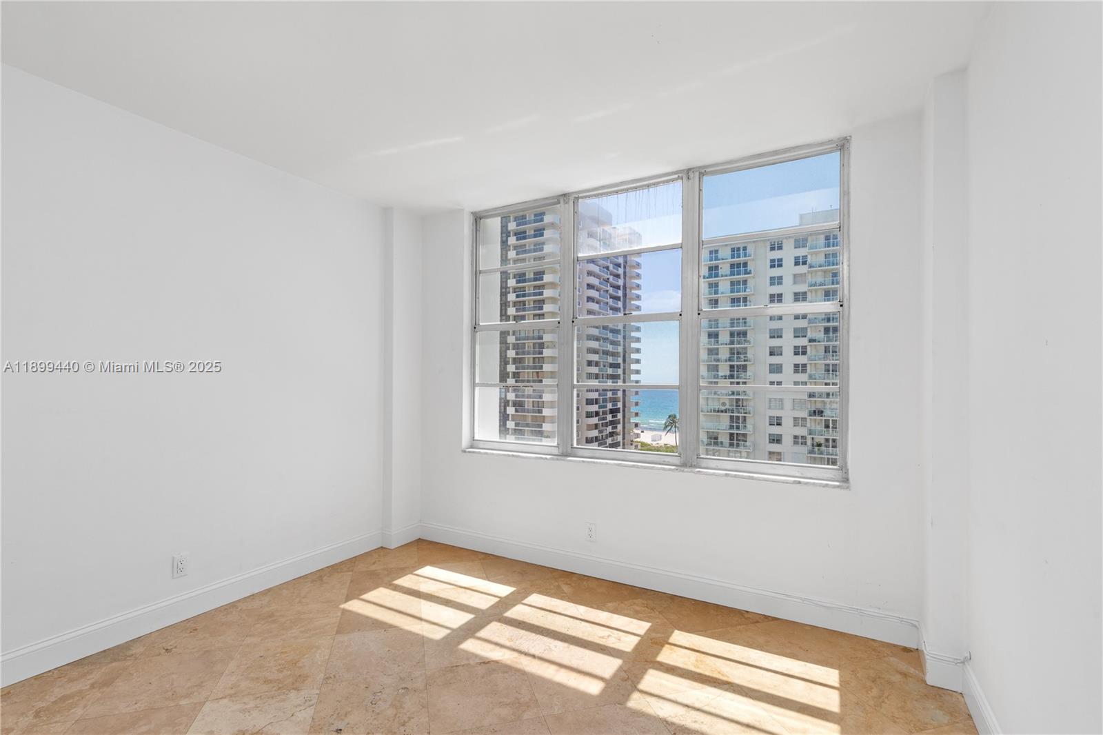 5700 Collins Avenue, Unit 10D Miami Beach, FL 33140 - Photo 29 of 47 a view of an empty room with a window