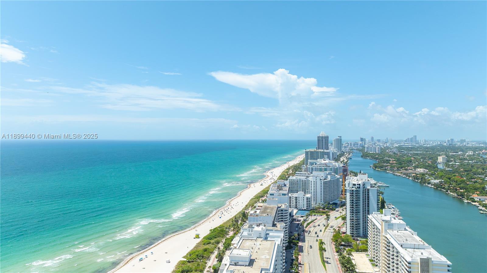 5700 Collins Avenue, Unit 10D Miami Beach, FL 33140 - Photo 38 of 47 a view of a city and a lake